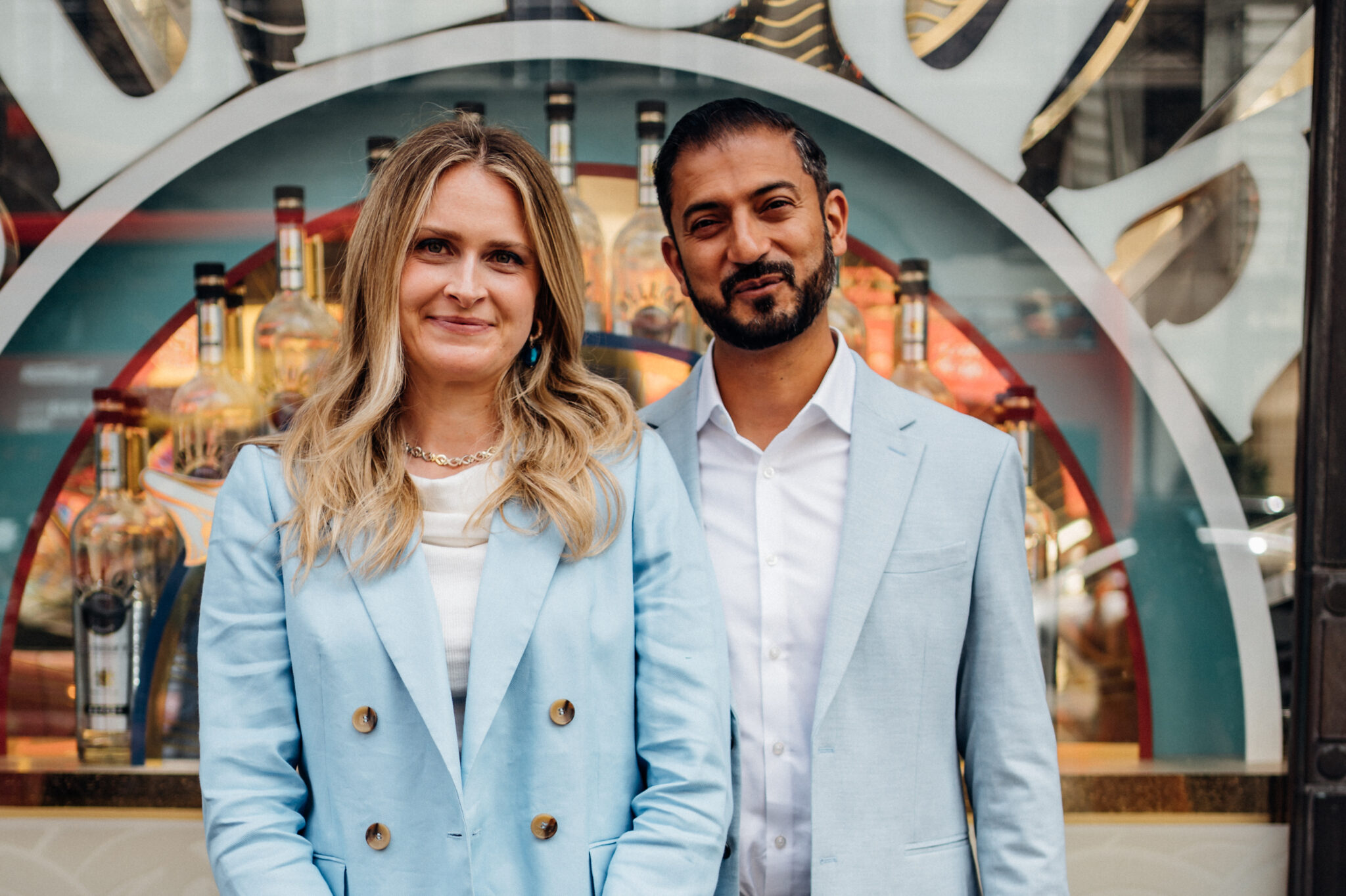 Couple in baby blue suits outisde Camden Town Hall